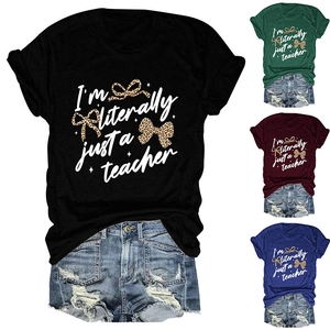 Close-up of crewneck T-shirts in four colors with teacher slogan and leopard bow