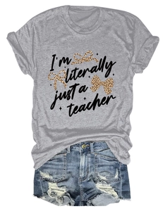 Detail of grey teacher t-shirt featuring leopard bows and cursive slogan lettering