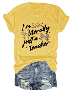 Detail of yellow cotton t-shirt with leopard bow print and 'I'm literally just a teacher'