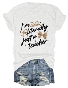 Flat lay detail of white t-shirt with teacher text and leopard bow plus denim shorts