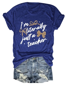 Detail of royal blue teacher t-shirt with leopard bows and ripped denim shorts