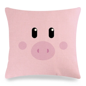 Detail of pink linen pillowcase featuring a cute cartoon pig face with textured fabric