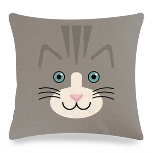 Detailed view of square linen pillowcase with cute cartoon cat face print on gray background