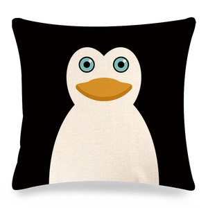Detailed close-up of a square linen pillowcase with a cartoon penguin print on black