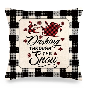 Detail of Christmas buffalo plaid linen pillowcase with reindeer and snowflake patterns