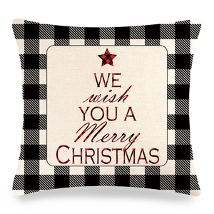 Detail of Christmas buffalo plaid pillow cover with linen texture and festive star text