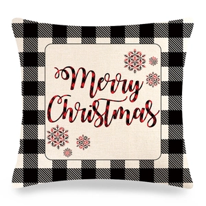 Detail view of Merry Christmas print on black and white buffalo check linen pillow cover