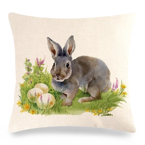 Detail of linen pillow cover showing watercolor Easter rabbit and floral egg print
