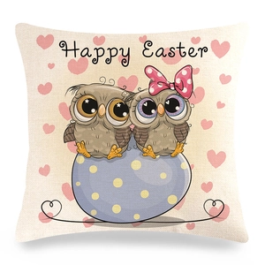 Detail of linen texture pillowcase featuring Happy Easter owls and blue egg pattern