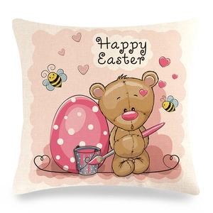 Detailed close-up of a square linen Easter pillowcase featuring a cute teddy bear and eggs