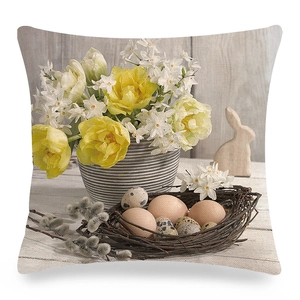 Close-up of Easter linen pillowcase with yellow tulips, eggs, and rabbit pattern texture