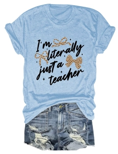 Detail of light blue teacher t-shirt featuring leopard bows and denim shorts