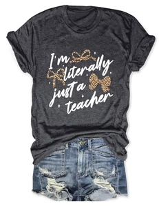 Flat-lay view of dark grey teacher t-shirt with leopard bows and text detail