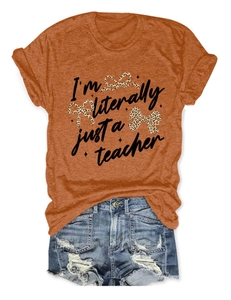 Detail of burnt orange t-shirt with teacher slogan and leopard print bows design