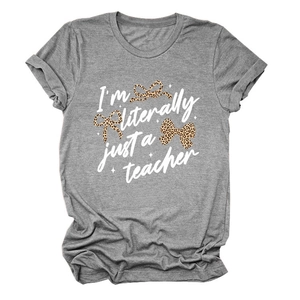 Detail of grey crewneck T-shirt featuring 'I'm literally just a teacher' and leopard bow