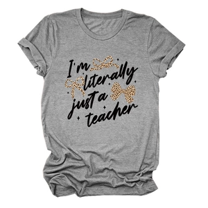 Detailed flat lay of a gray crew neck T-shirt with teacher text and leopard bows