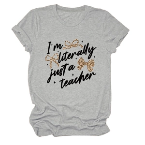 Detail view of light gray cotton t-shirt with teacher text and leopard bows print
