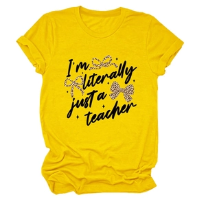 Detail of teacher slogan print with leopard bows on yellow cotton t-shirt fabric