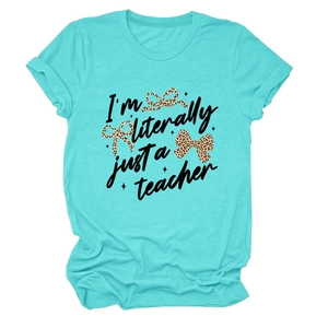 Close-up of turquoise cotton T-shirt featuring 'I'm literally just a teacher' text and bows