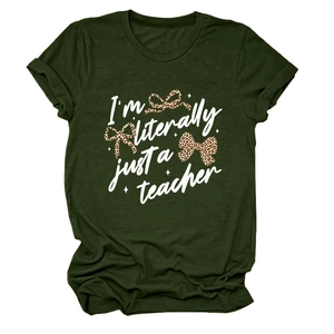 Detail of forest green T-shirt featuring I'm literally just a teacher text and leopard bows