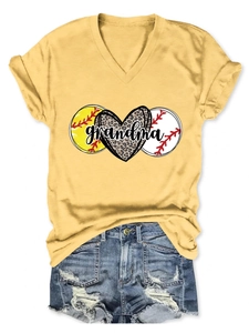 Flat lay of yellow V-neck T-shirt with grandma leopard print and ripped denim shorts