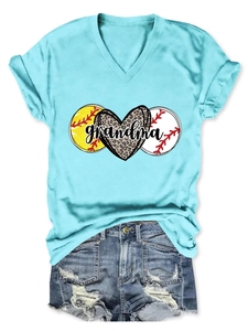 Flat lay detail of a blue V-neck T-shirt with leopard heart print and denim shorts