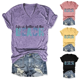 Detail view of V-neck T-shirt with Beach text and matching frayed denim shorts set