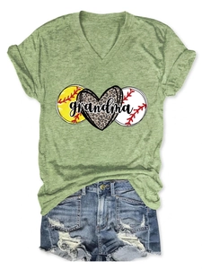 Close-up of green V-neck T-shirt with leopard heart and grandma print on a flat lay