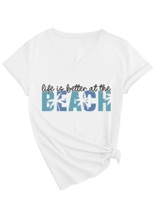 Detail of white V-neck T-shirt with BEACH print and stylish front knot design