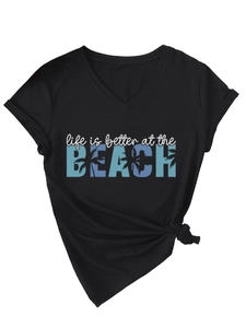 Detail of V-neck black t-shirt with beach print and trendy side-knot styling detail