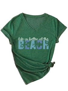 Detail of V-neck T-shirt showing beach slogan print and decorative front knot design
