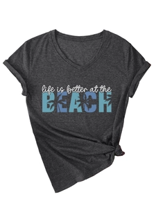Detail of V-neck grey heather tee with beach print and trendy side knot design