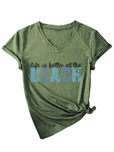 Detail of V-neck olive green T-shirt featuring beach lettering and front knot design