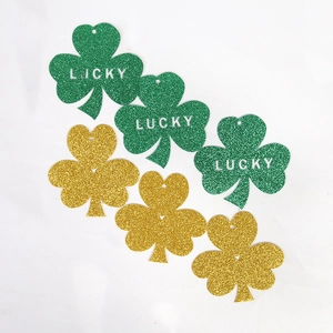 Glittery St. Patrick's Day clover swirl decorations with Lucky cutout and gold finish