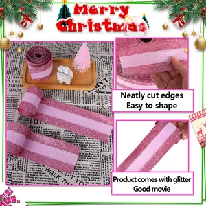 Close-up of pink glitter Christmas ribbon with a sheer center stripe for DIY gift wrapping