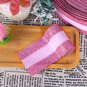 Detail of pink glitter ribbon with satin center for gift wrapping and DIY crafts