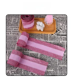 Macro detail of 2m pink glitter ribbon showing textured sparkles and flexible woven material
