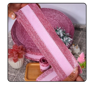 Detailed close-up of pink glitter elastic ribbon with metallic texture for DIY gift wrapping