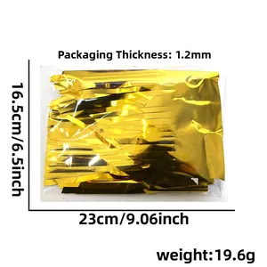 Detail of gold foil fringe curtain in packaging showing size 16.5cm x 23cm for parties