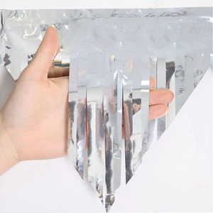 Close-up of shiny silver metallic fringe tinsel curtain for party backdrop decoration