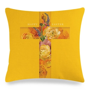 Dettaglio della trama della federa in lino giallo con croce floreale e scritta Happy Easter