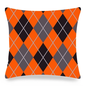 Detail of Christmas plaid pillowcase with orange and grey argyle pattern on peach skin fabric