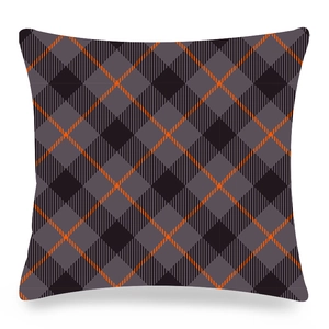Detail of gray and black diamond plaid pillowcase with orange dashed line accents