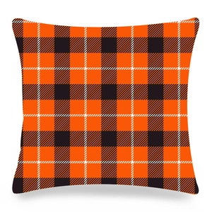 Detail of orange and black buffalo plaid peach skin fabric pillowcase for Christmas