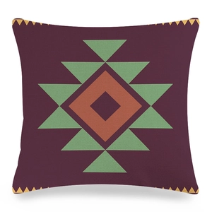 Gros plan du motif ethnique géométrique sur la texture en lin de la housse de coussin