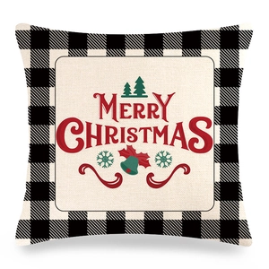 Détail de la taie d'oreiller de Noël en lin avec motif écossais noir et lettrage rouge
