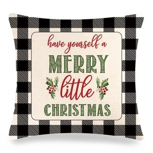 Détail de la taie d'oreiller de Noël à carreaux avec typographie de fête et motif baies