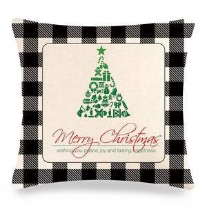 Detail of Christmas buffalo plaid pillow cover featuring a festive holiday tree design