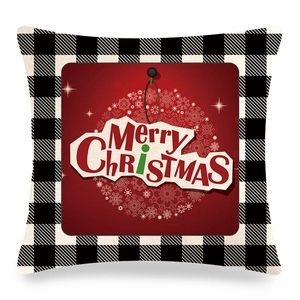 Detail of linen Christmas pillowcase featuring black buffalo plaid and Merry Christmas print