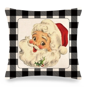 Detail of Christmas buffalo plaid linen pillowcase with vintage Santa Claus illustration